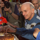 Dennis Tito takes a bite, 2001